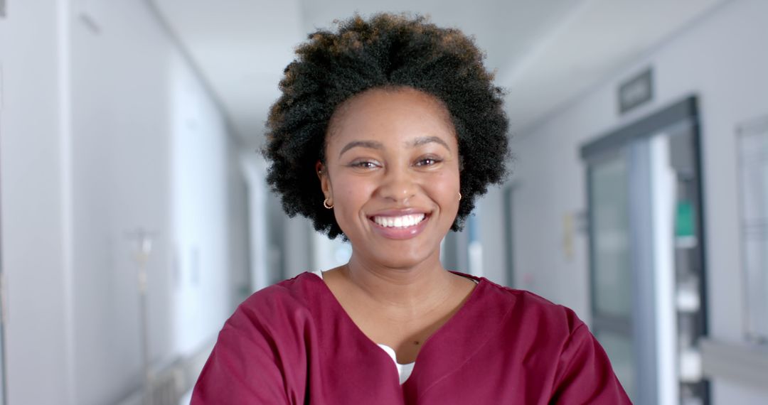 Smiling African American Nurse in Hospital Corridor - Free Images, Stock Photos and Pictures on Pikwizard.com