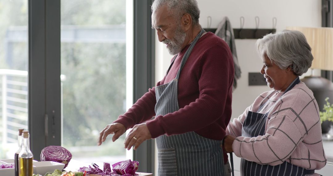 Elderly Couple Cooking Together in Kitchen - Free Images, Stock Photos and Pictures on Pikwizard.com