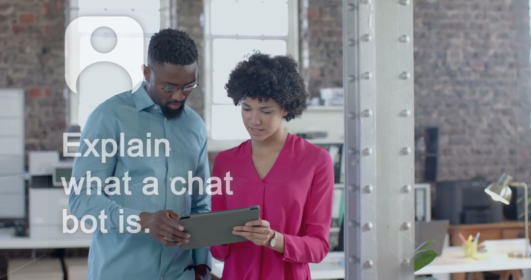 Two Colleagues Using Digital Tablet for Work Discussion