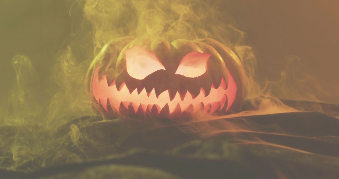 Glowing Jack-o'-Lantern with Sinister Carved Face, Amber Fog and Moody Halloween Glow