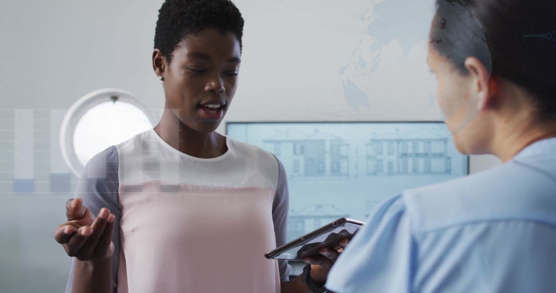 Colleagues Collaborating on Digital Financial Project in Office