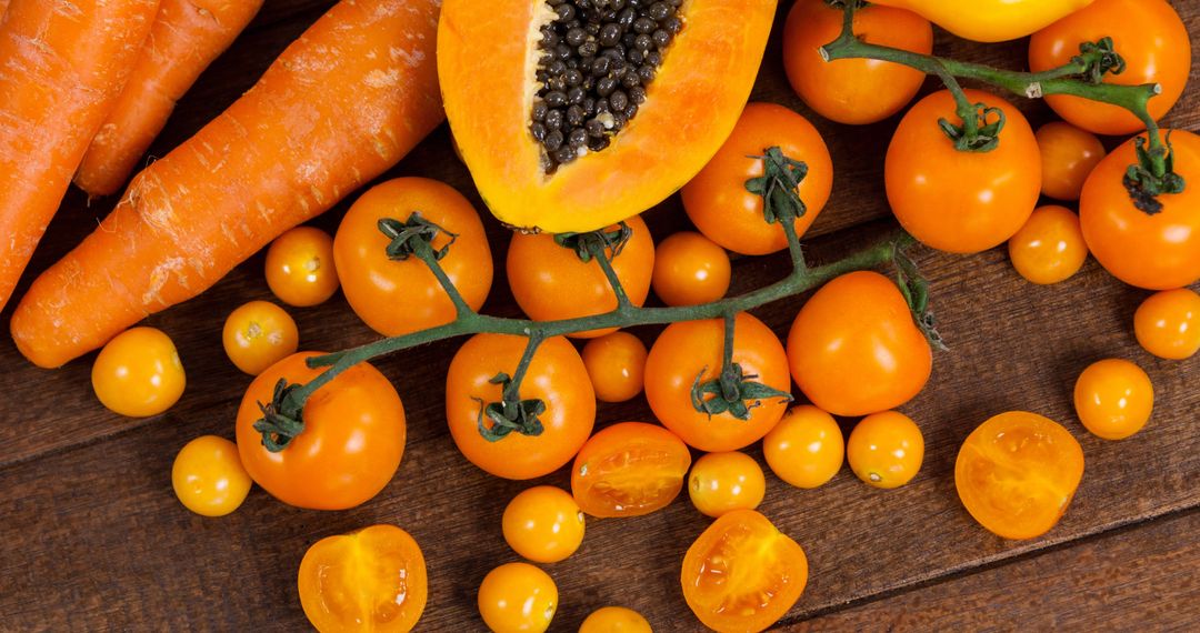 Assorted Orange Vegetables on Wooden Table Surface