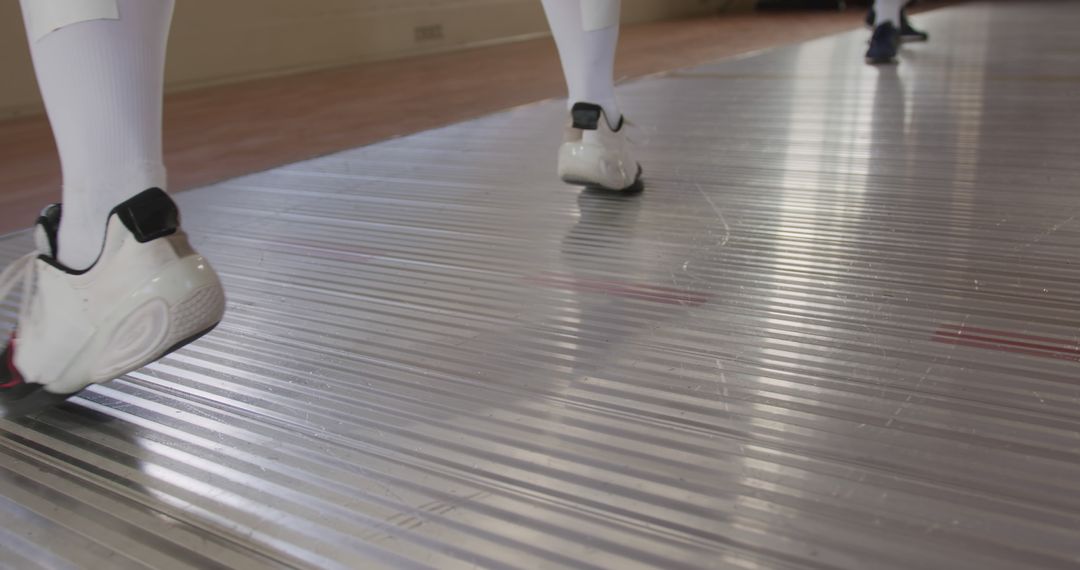 Fencers Engaged in Duel on Sport Flooring - Free Images, Stock Photos and Pictures on Pikwizard.com