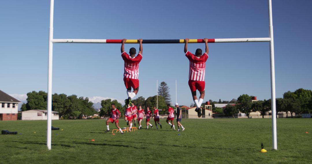Youth Rugby Players Doing Exercises or Training On Field