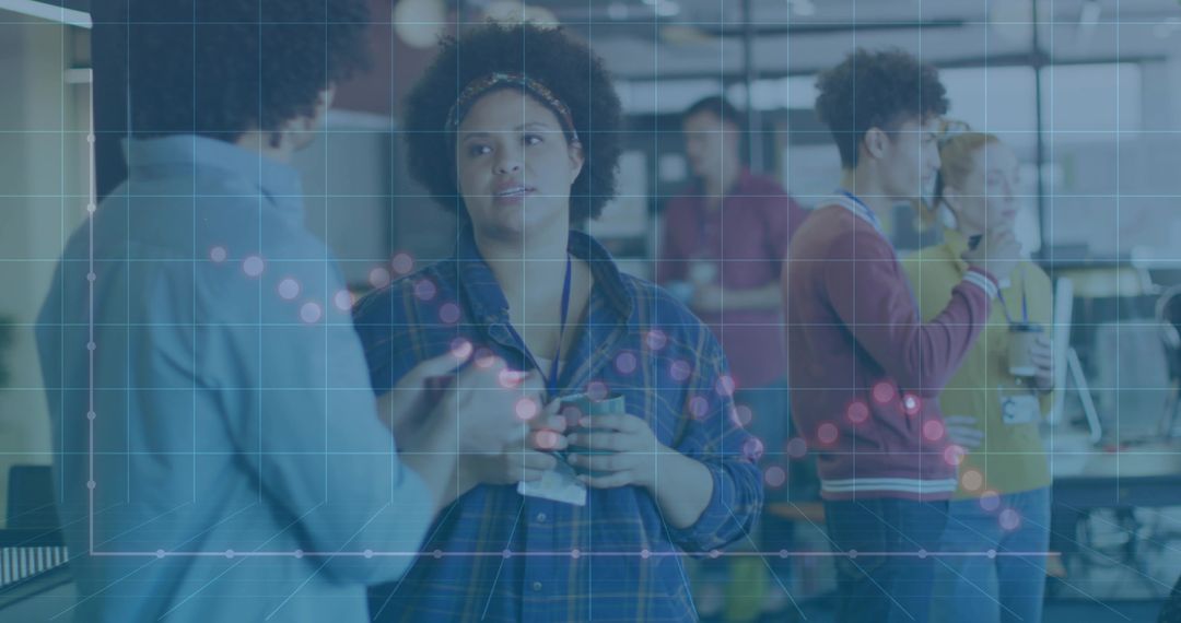 Diverse Team Collaborating in Open-Plan Office with Data Overlay