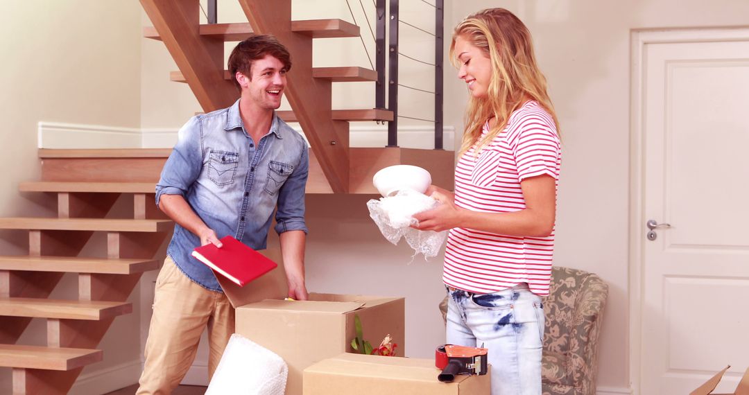 Happy Couple Unpacking in Their New Home