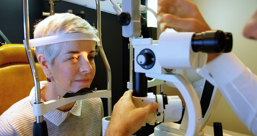 Senior Woman Undergoing Eye Examination with High-Tech Medical Equipment - Free Images, Stock Photos and Pictures on Pikwizard.com