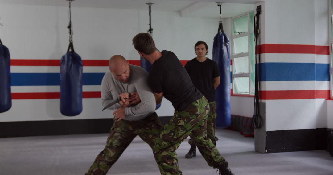 Men Practicing Martial Arts in Training Studio - Free Images, Stock Photos and Pictures on Pikwizard.com