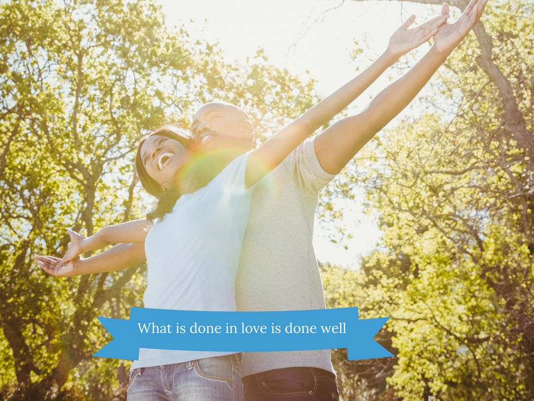 Joyful Couple Embracing Under Sunlight in Scenic Park