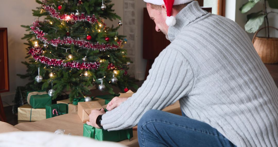 Man Wrapping Gifts in Festive Christmas Setting
