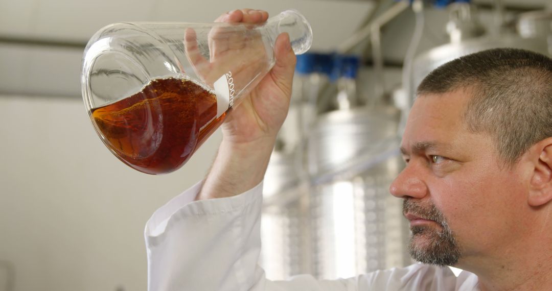 Scientist Examining Chemical Sample in Laboratory Setting - Free Images, Stock Photos and Pictures on Pikwizard.com