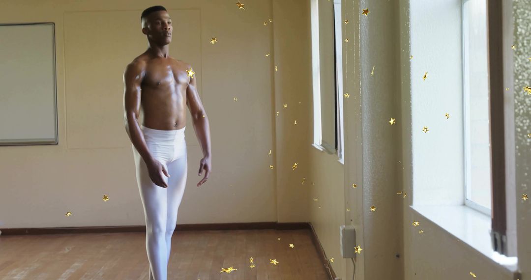 Elegant Ballet Dancer Posing in Sunlit Studio with Confetti