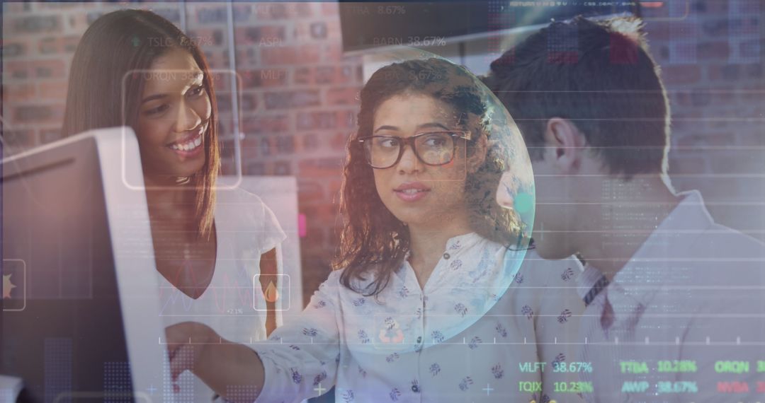 Diverse Team Collaborating Over Data in Modern Tech Environment