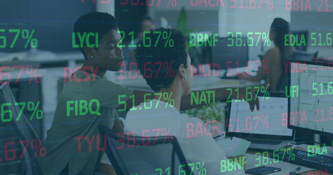 Diverse Coworkers Discussing Stock Market Analysis in Office