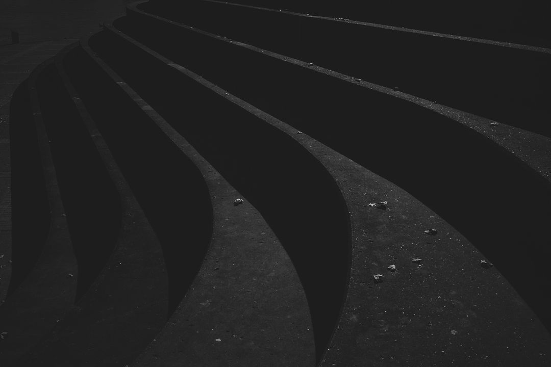Abstract Curved Staircase in Dark Minimalist Setting - Free Images, Stock Photos and Pictures on Pikwizard.com