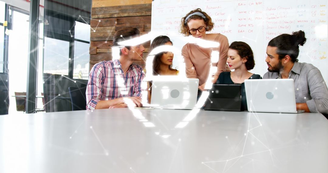 Team Collaborating on Data Security Strategy with Digital Overlay