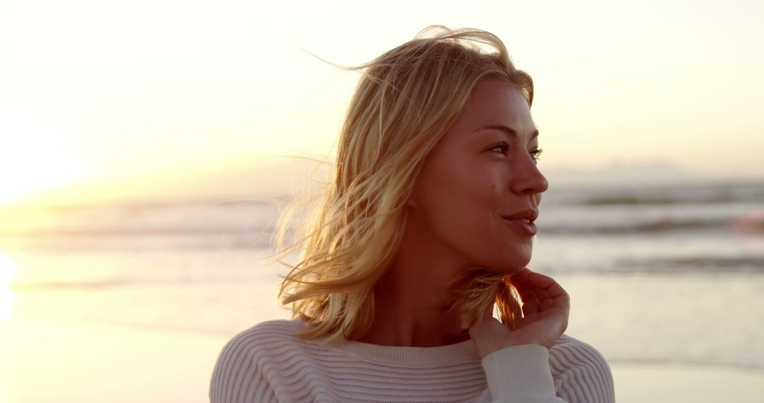 Serene Woman Enjoying Sunset at Beach - Free Images, Stock Photos and Pictures on Pikwizard.com