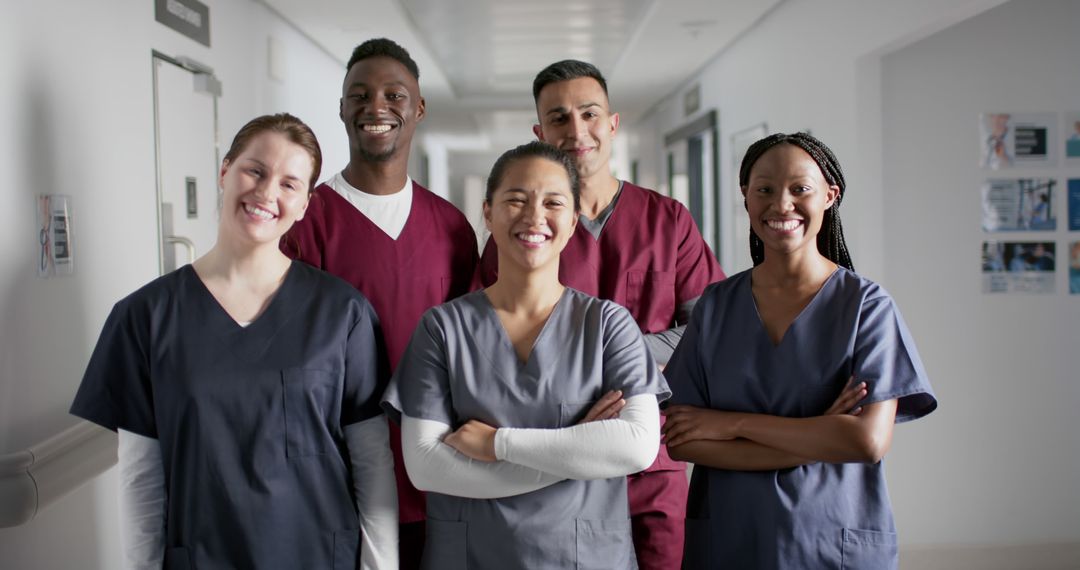 Group of Confident Medical Students Smiling in Hospital Hallway - Free Images, Stock Photos and Pictures on Pikwizard.com