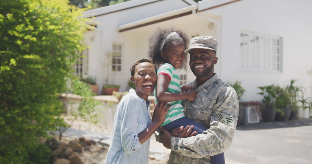 Joyful Soldier Family Reunited in Front of Modern Home