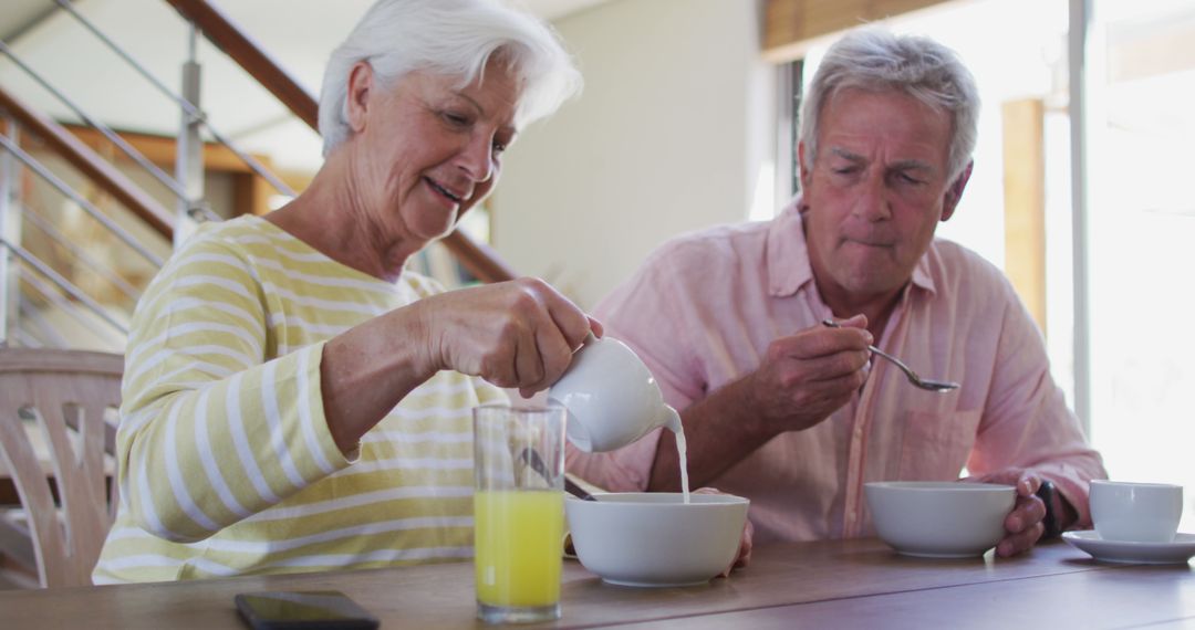 Senior Couple Enjoying Healthy Breakfast at Home - Free Images, Stock Photos and Pictures on Pikwizard.com