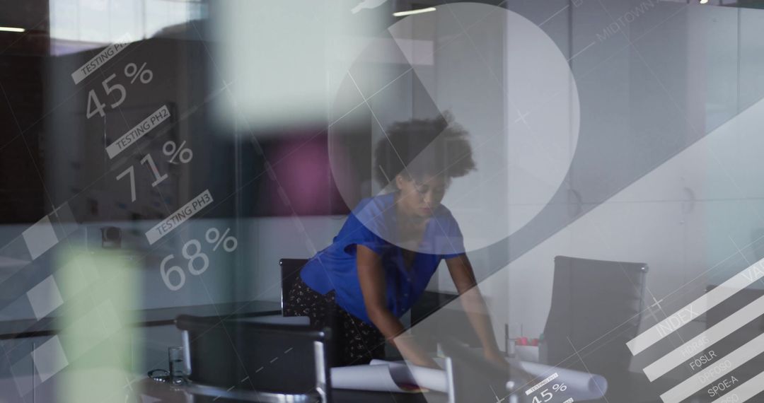 Businesswoman Reviewing Plans with Digital Data Graphics Overlay