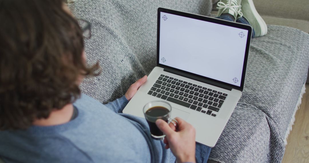 Man Working from Home on Laptop with Coffee - Free Images, Stock Photos and Pictures on Pikwizard.com