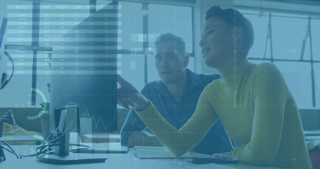 Colleagues Analyze Digital Data in Modern Office Setting