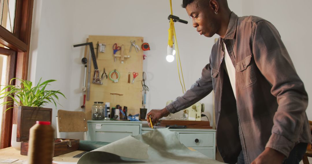 Skilled Artisan Crafting Leather in Modern Workshop