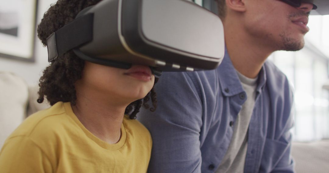 Father and Child Using VR Headsets for Virtual Reality Experience - Free Images, Stock Photos and Pictures on Pikwizard.com