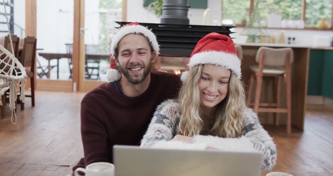 Smiling Couple Enjoying Christmas Video Call on Laptop at Home - Free Images, Stock Photos and Pictures on Pikwizard.com