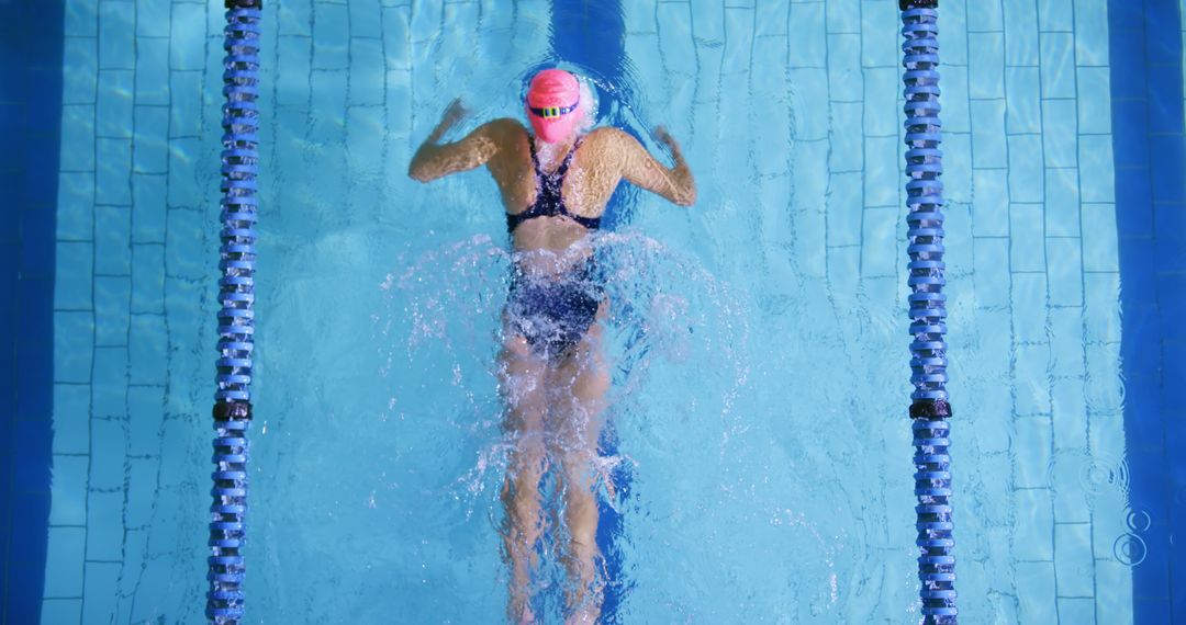 Female Swimmer Practicing Butterfly Stroke in Pool - Free Images, Stock Photos and Pictures on Pikwizard.com