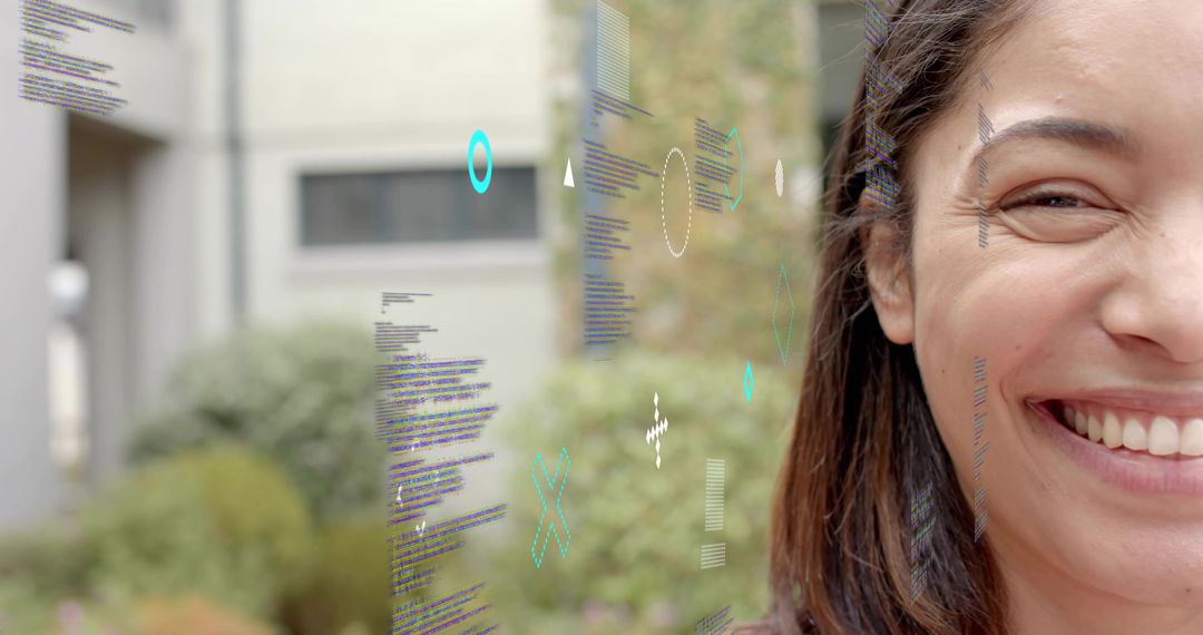 Smiling woman with holographic code overlay in green courtyard, tech portrait