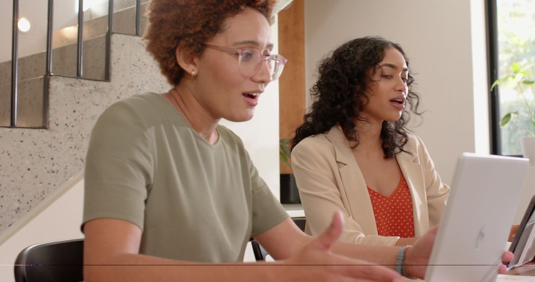 Diverse Female Coworkers Collaborating in Modern Office Setting