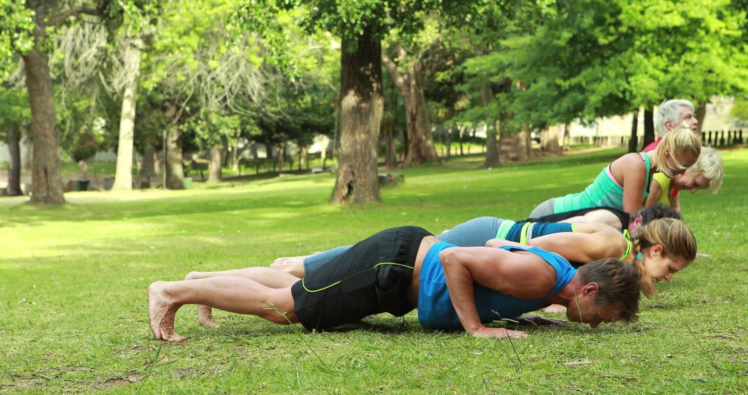 Group of People Doing Push-ups in Park - Free Images, Stock Photos and Pictures on Pikwizard.com