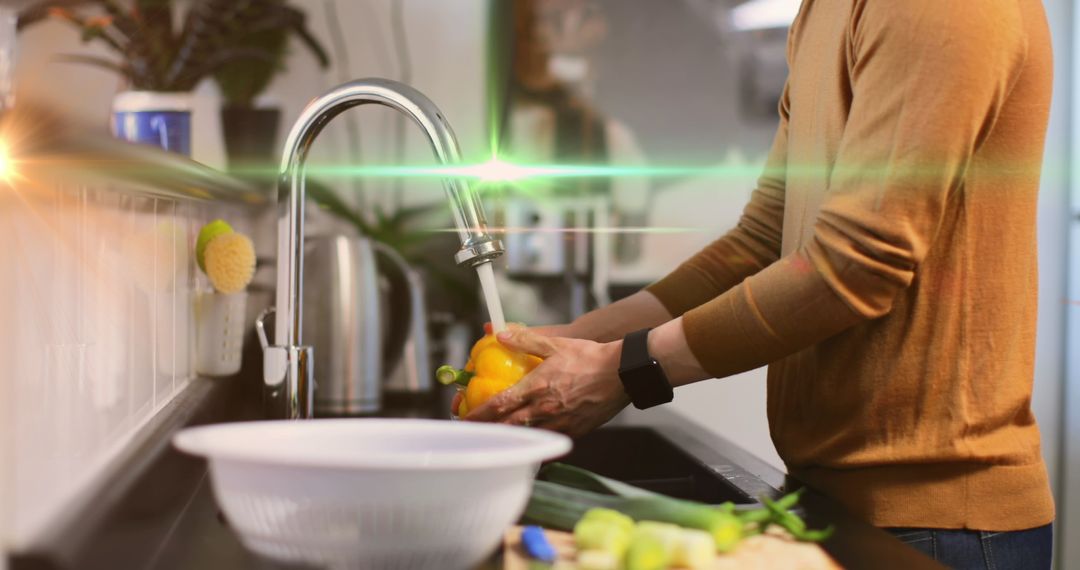Man Washing Fresh Vegetables Under Kitchen Faucet With Green Light Effect