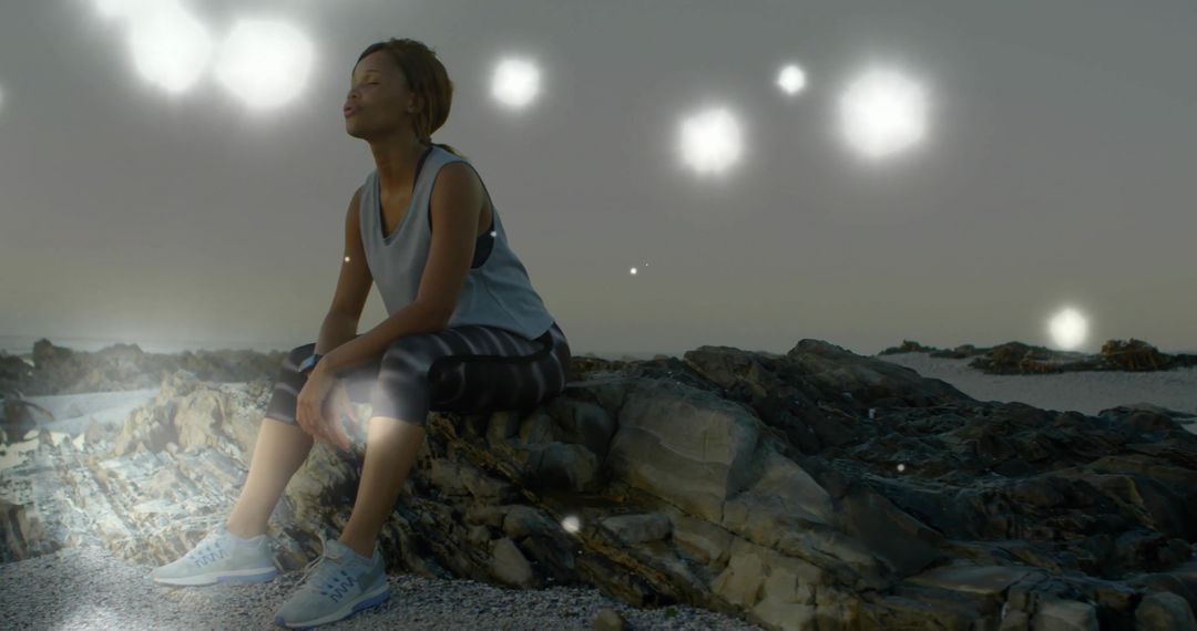 Peaceful Reflection with Glowing Orbs on Rocky Coastline