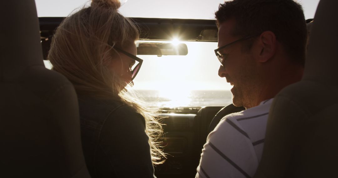 Happy Couple Enjoying Sunset Drive in Convertible - Free Images, Stock Photos and Pictures on Pikwizard.com