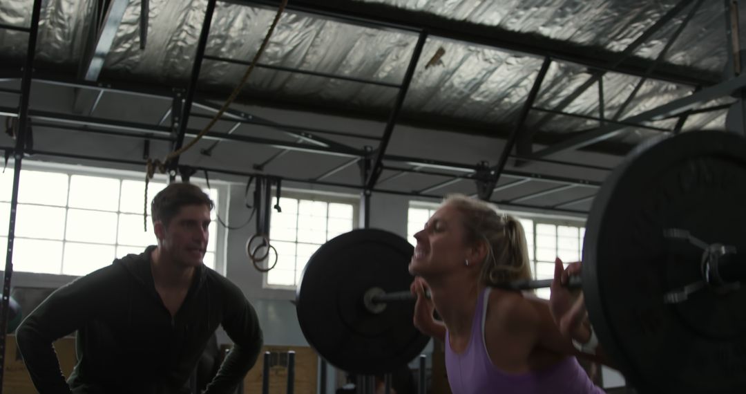 Strong Woman Lifting Weights with Personal Trainer at Gym - Free Images, Stock Photos and Pictures on Pikwizard.com