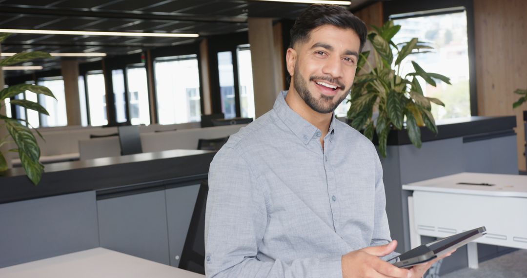 Professional Confident Businessman in Modern Office with Tablet