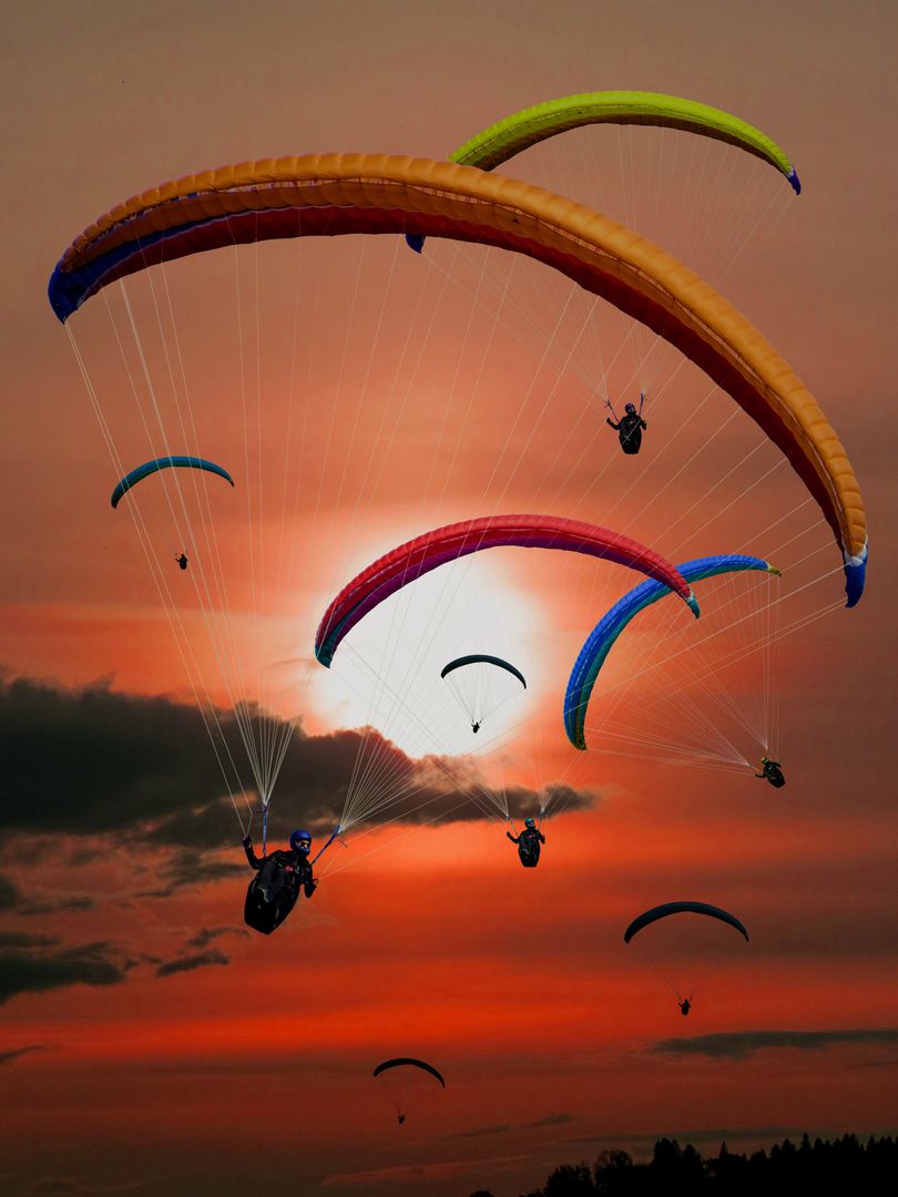 People Riding Parachutes during Sunset - Free Images, Stock Photos and Pictures on Pikwizard.com