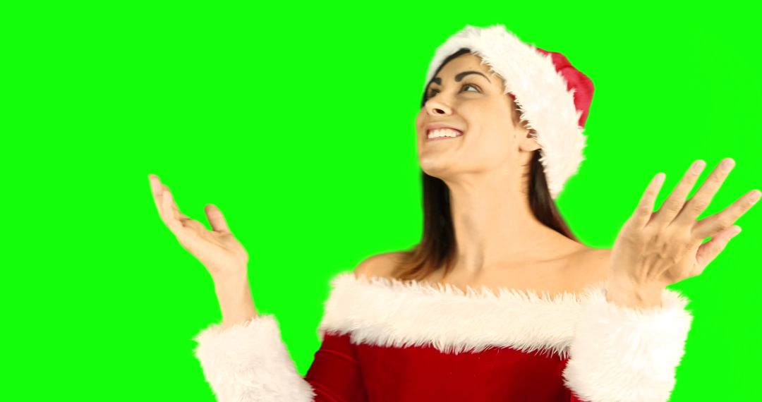 Excited Young Woman in Santa Claus Hat on Green Screen Background - Free Images, Stock Photos and Pictures on Pikwizard.com