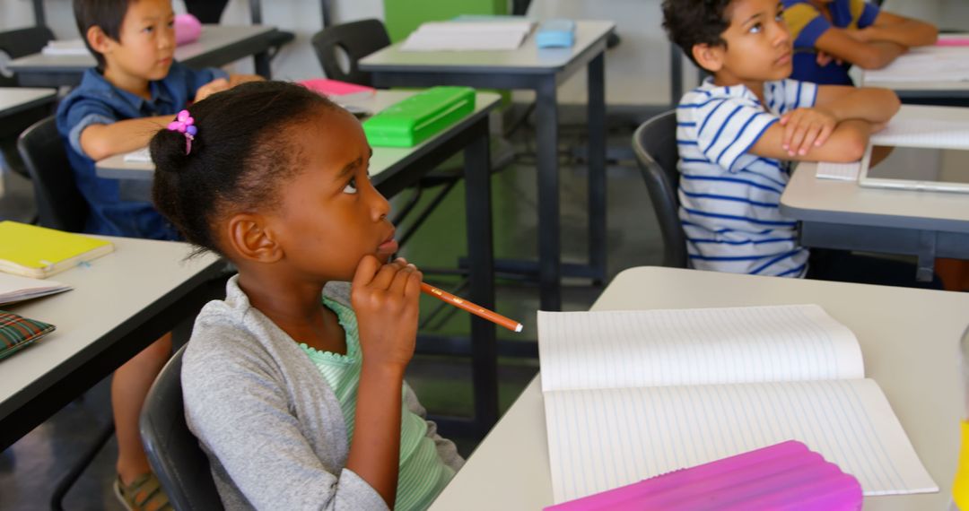Attentive Young Students Listening in Classroom