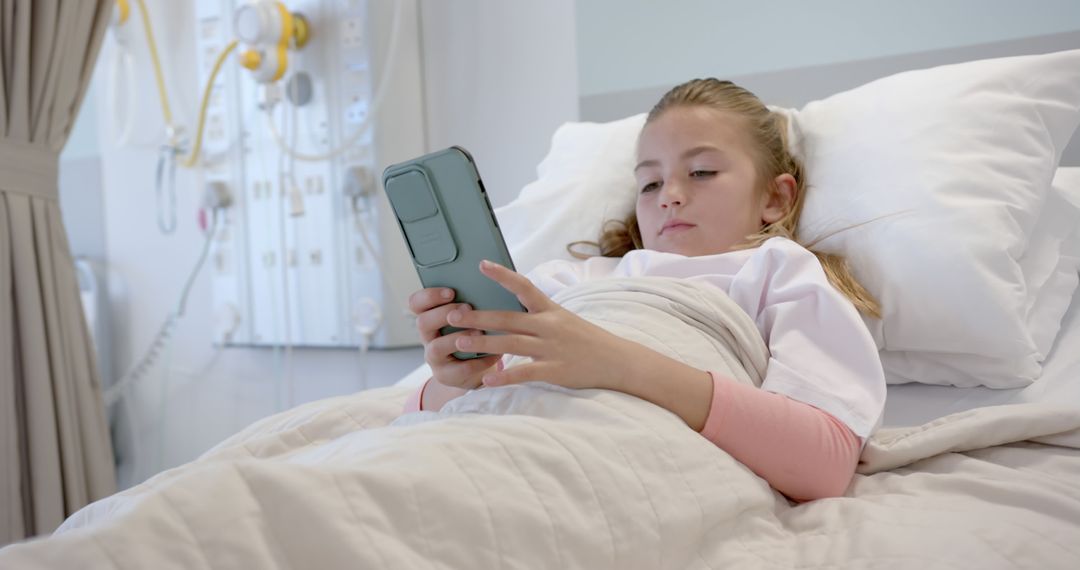 Child in Hospital Bed Using Smartphone for Companionship - Free Images, Stock Photos and Pictures on Pikwizard.com