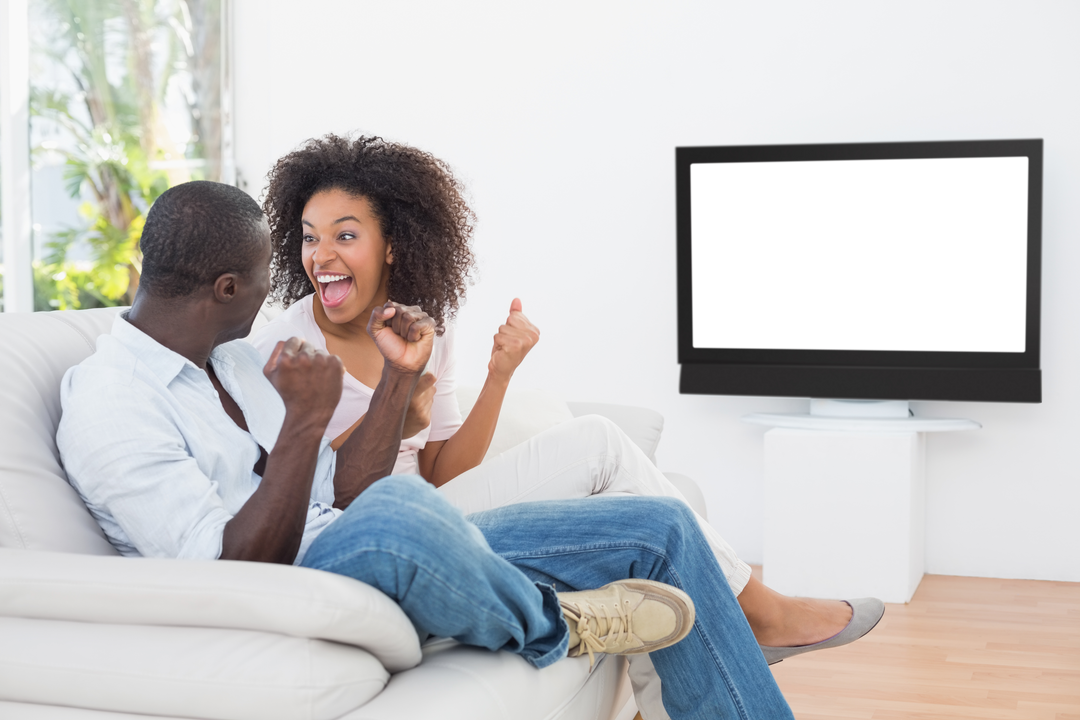 Joyful Couple Cheering In Living Room With Transparent Television Screen - Download Free Stock Images Pikwizard.com