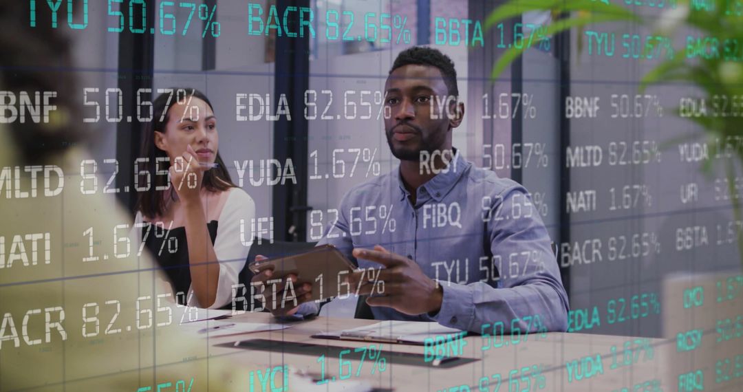 Diverse Colleagues Meet Amid Digital Stock Market Display