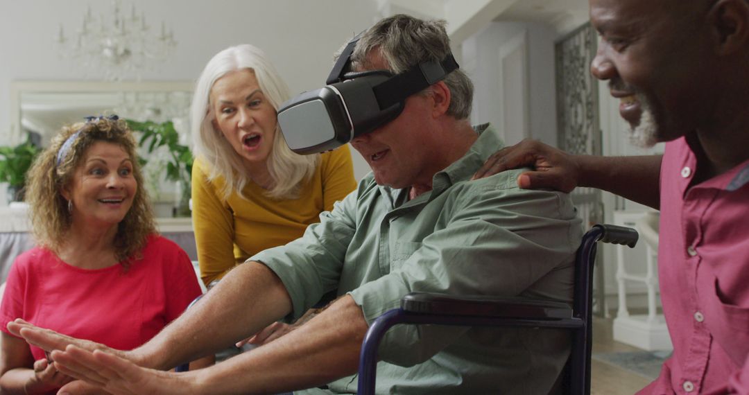 Image of happy senior man in wheelchair using vr headset and having fun with diverse friends - Free Images, Stock Photos and Pictures on Pikwizard.com