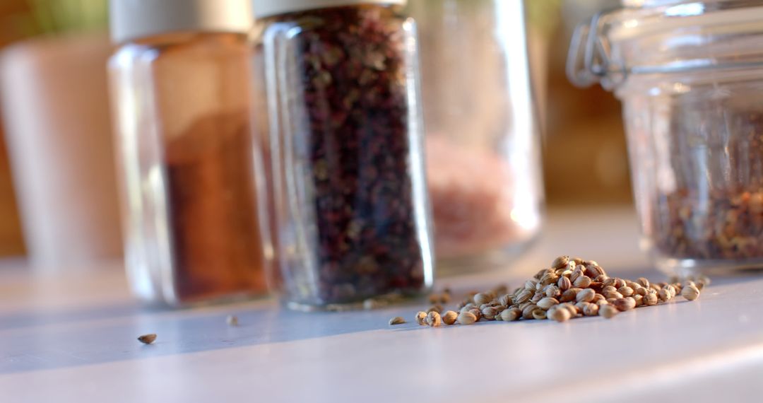 Herbs and Seeds in Jars on Kitchen Counter - Free Images, Stock Photos and Pictures on Pikwizard.com