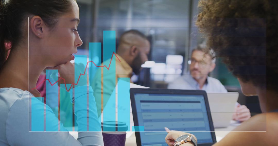 Diverse Team Analyzing Data Growth in Modern Office