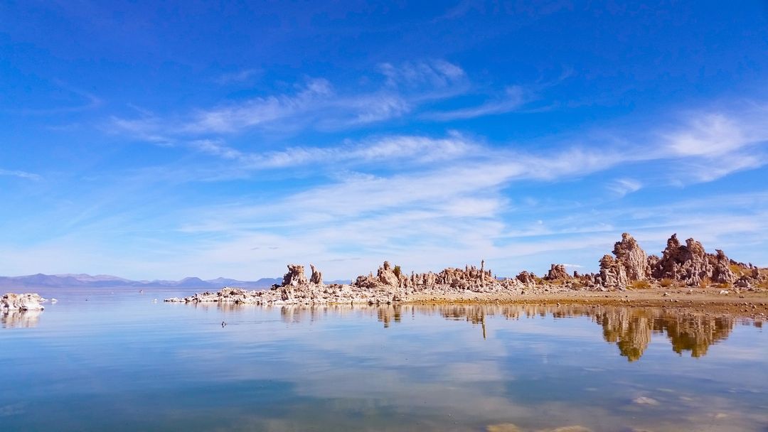 Clear blue sky over Mono Lake with tufa formations - Free Images, Stock Photos and Pictures on Pikwizard.com