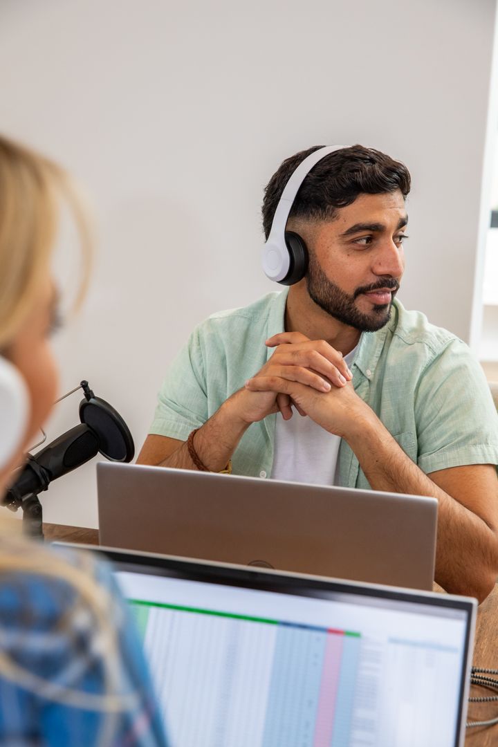 Diverse Coworkers Recording Podcast in Modern Studio
